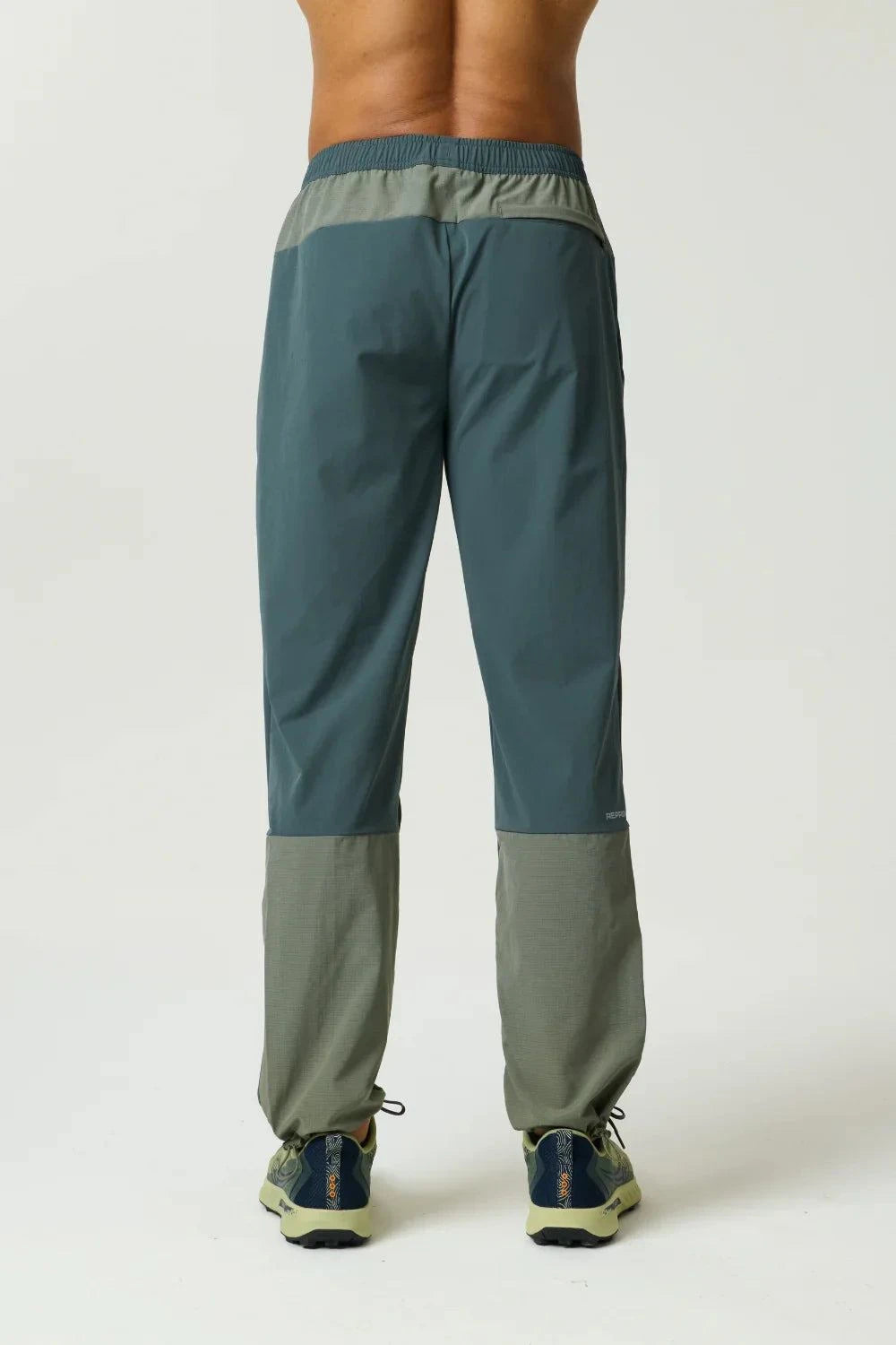 Reprimo Clima Pants in dark moss and khaki with dual-fabric design and breathable calves for active wear