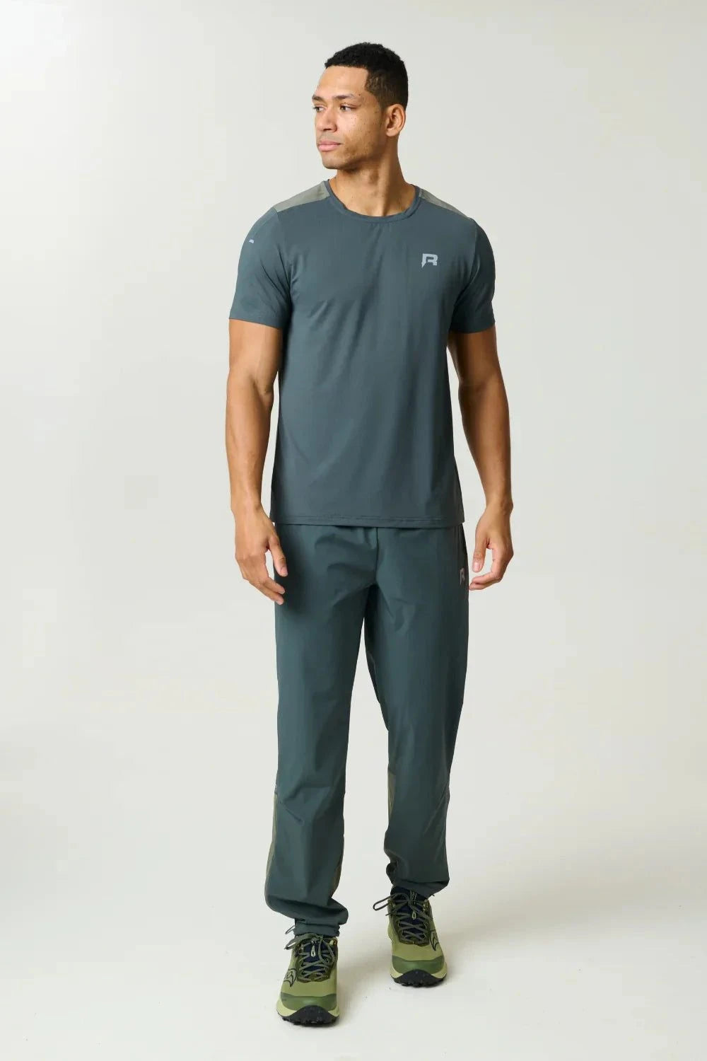 Reprimo Clima Pants in dark moss and khaki with dual-fabric design, breathable calf panels, adjustable ankles, and looser active fit for outdoor performance