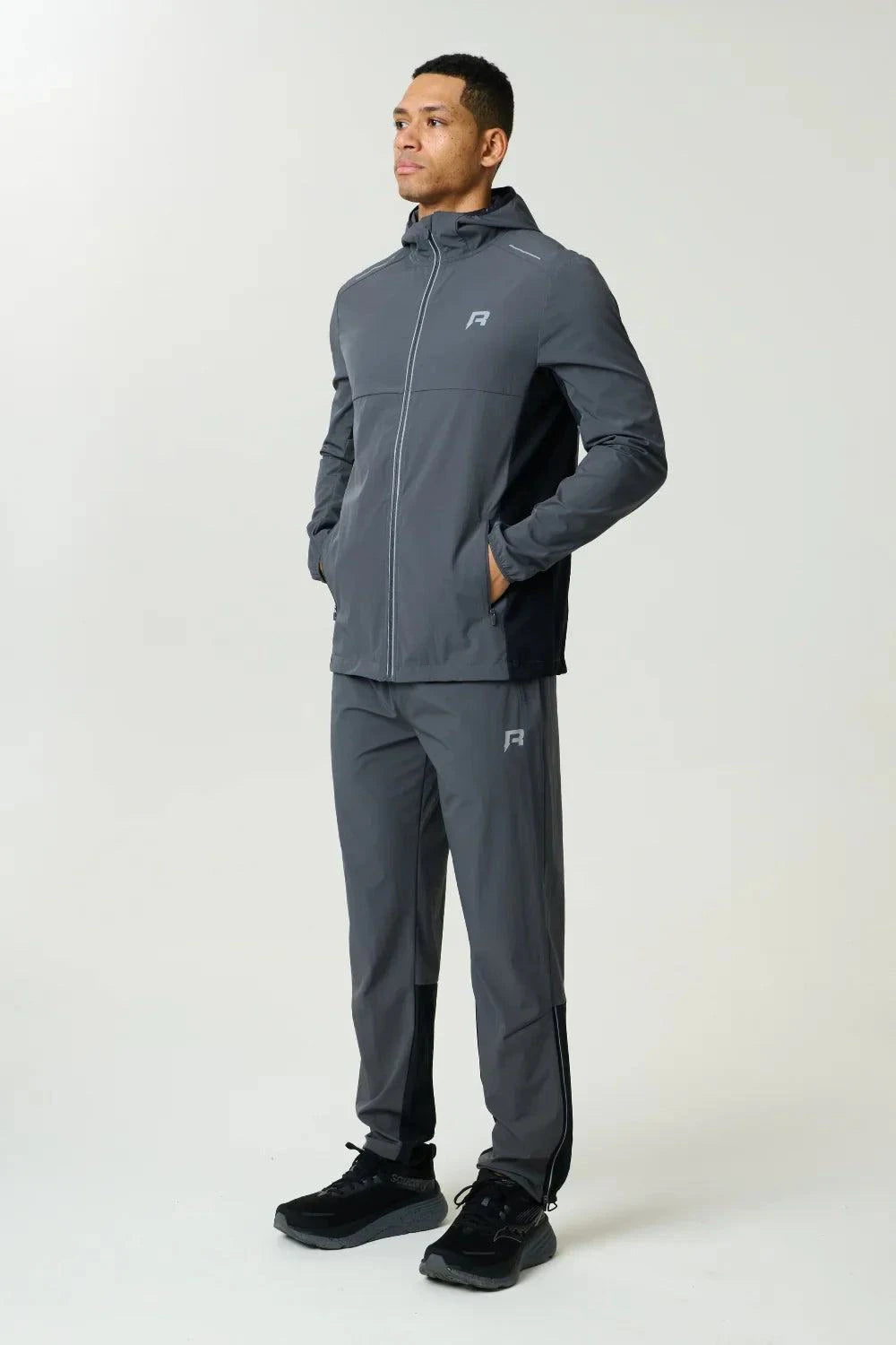 Reprimo Clima Shell Jacket in slate and obsidian with insulated loft, reflective branding, and secure zip pockets for cold weather.