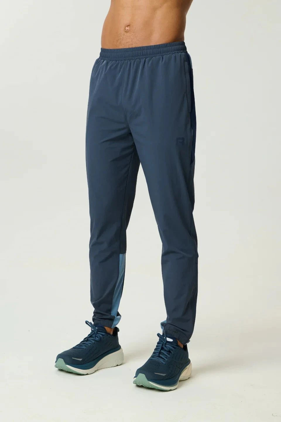 Reprimo Vortex Pants in Dusty Blue and Ink Blue with ergonomic panels and adjustable waistband for flexible performance