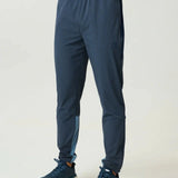 Reprimo Vortex Pants in Dusty Blue and Ink Blue with ergonomic panels and adjustable waistband for flexible performance