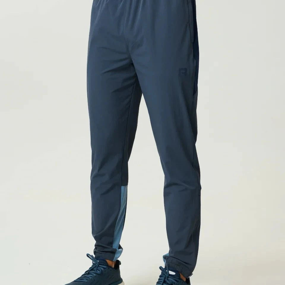 Reprimo Vortex Pants in Dusty Blue and Ink Blue with ergonomic panels and adjustable waistband for flexible performance