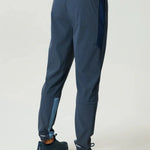 Reprimo Vortex Pants in Dusty Blue and Ink Blue with ergonomic paneling and adjustable waistband for flexible performance