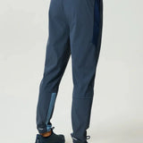 Reprimo Vortex Pants in Dusty Blue and Ink Blue with ergonomic paneling and adjustable waistband for flexible performance