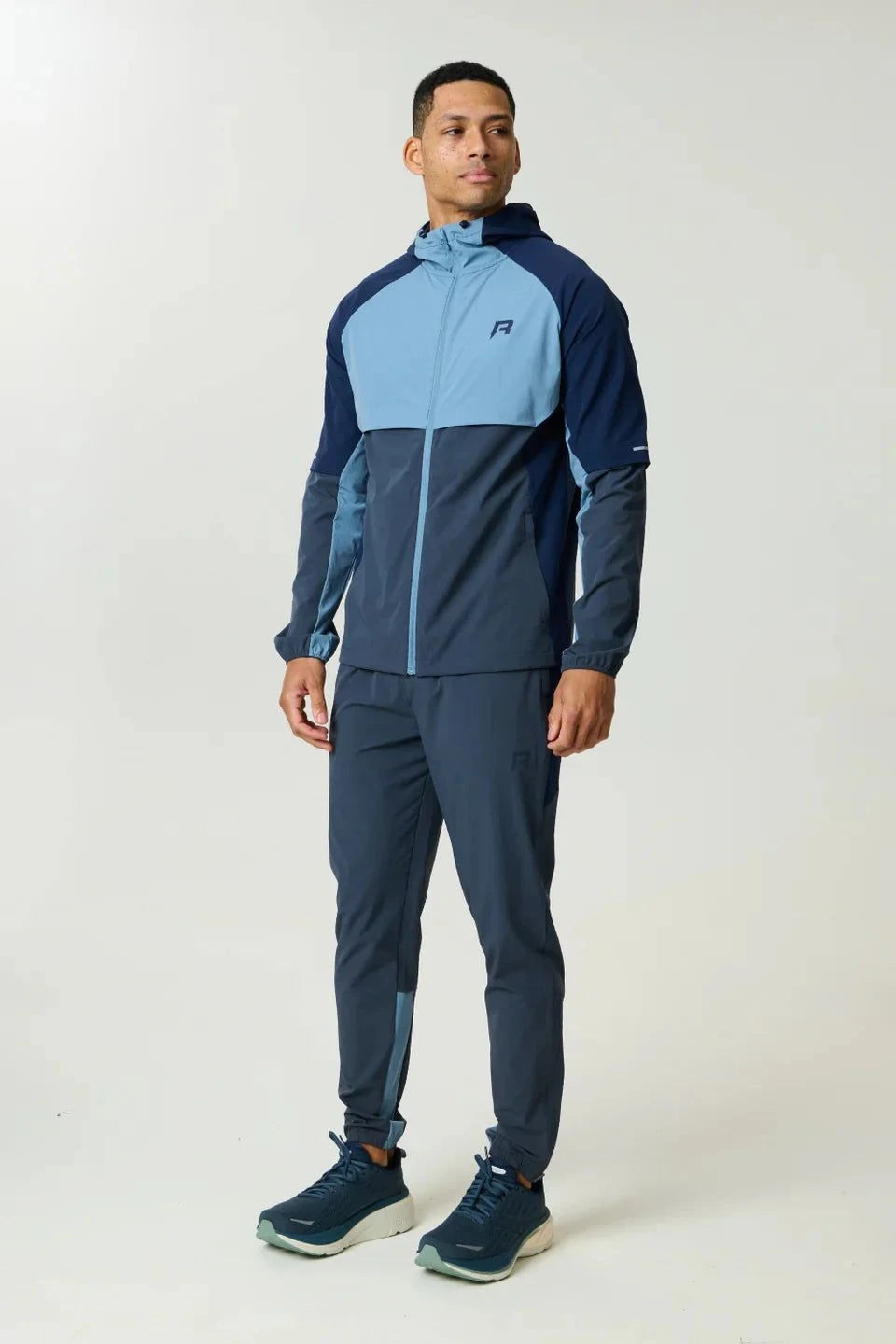 Reprimo Vortex Pants in dusty blue and ink blue with ergonomic panels and adjustable waistband for flexible, performance-driven comfort