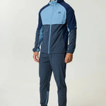 Reprimo Vortex Pants in dusty blue and ink blue with ergonomic panels and adjustable waistband for flexible, performance-driven comfort