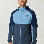 Reprimo Vortex Windbreaker dusty blue with ergonomic design and reflective details, lightweight wind-resistant jacket
