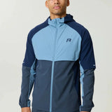 Reprimo Vortex Windbreaker dusty blue with ergonomic design and reflective details, lightweight wind-resistant jacket