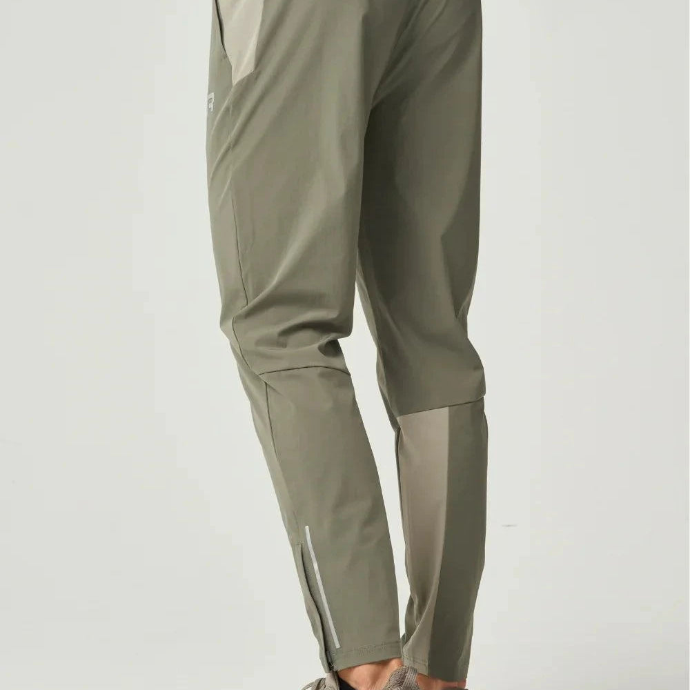 Khaki Reprimo Flight Pant with functional pockets and reflective strips for athletic performance and comfort