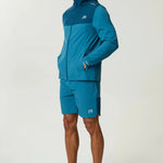 Reprimo Flight Windbreaker in lake blue and teal with zip pockets and lightweight polyamide fabric for wind and rain protection