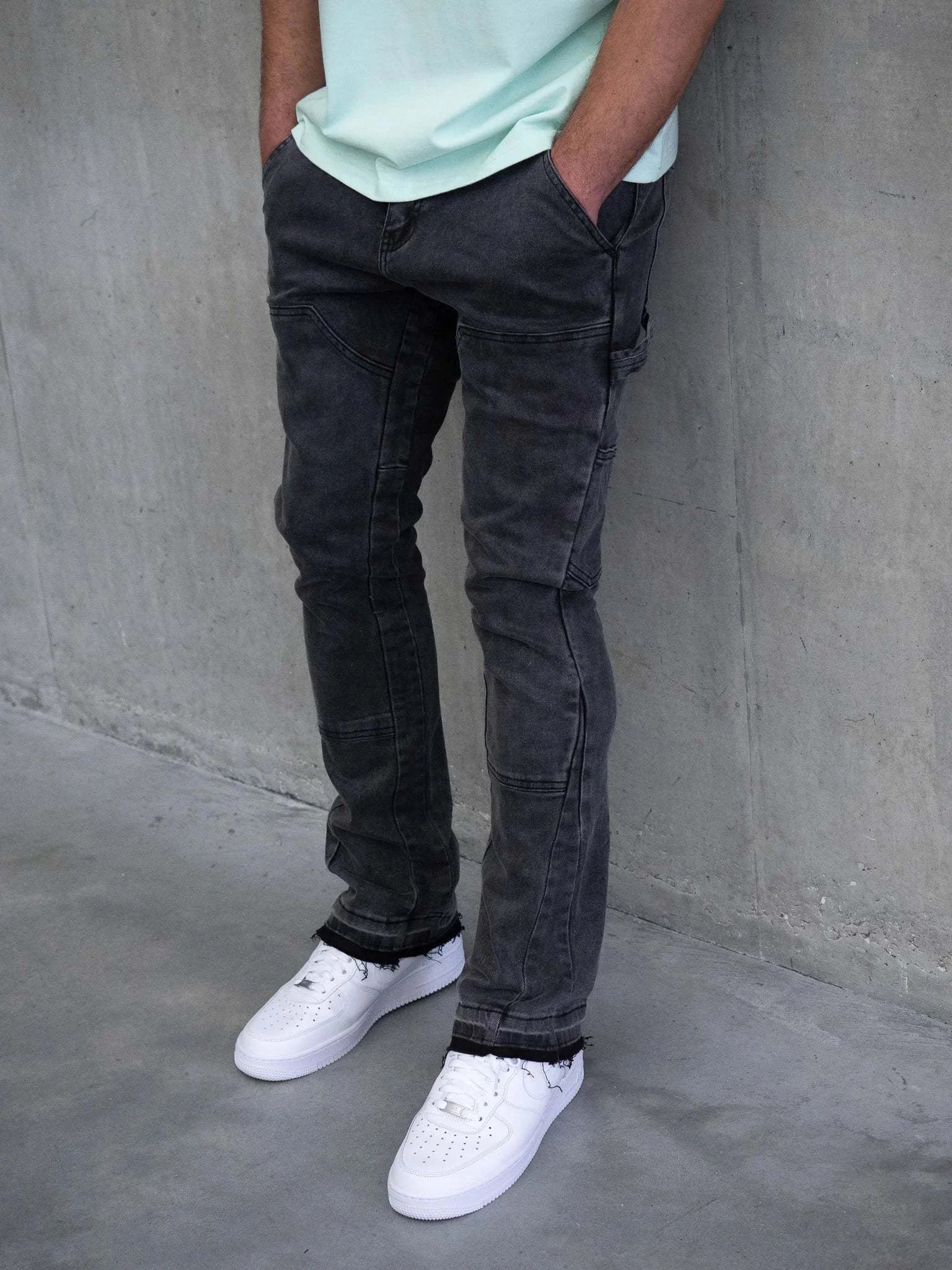 Slim fit Siarr carpenter jeans in washed black with multiple pockets and patchwork design