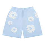 Denim Tears The Cotton Wreath Sweatshorts in Powder Blue with white wreath design.