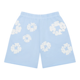 Denim Tears The Cotton Wreath Sweatshorts in Powder Blue with white wreath pattern.