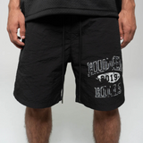 Suavo World Hidden Hills black swim shorts with logo design.