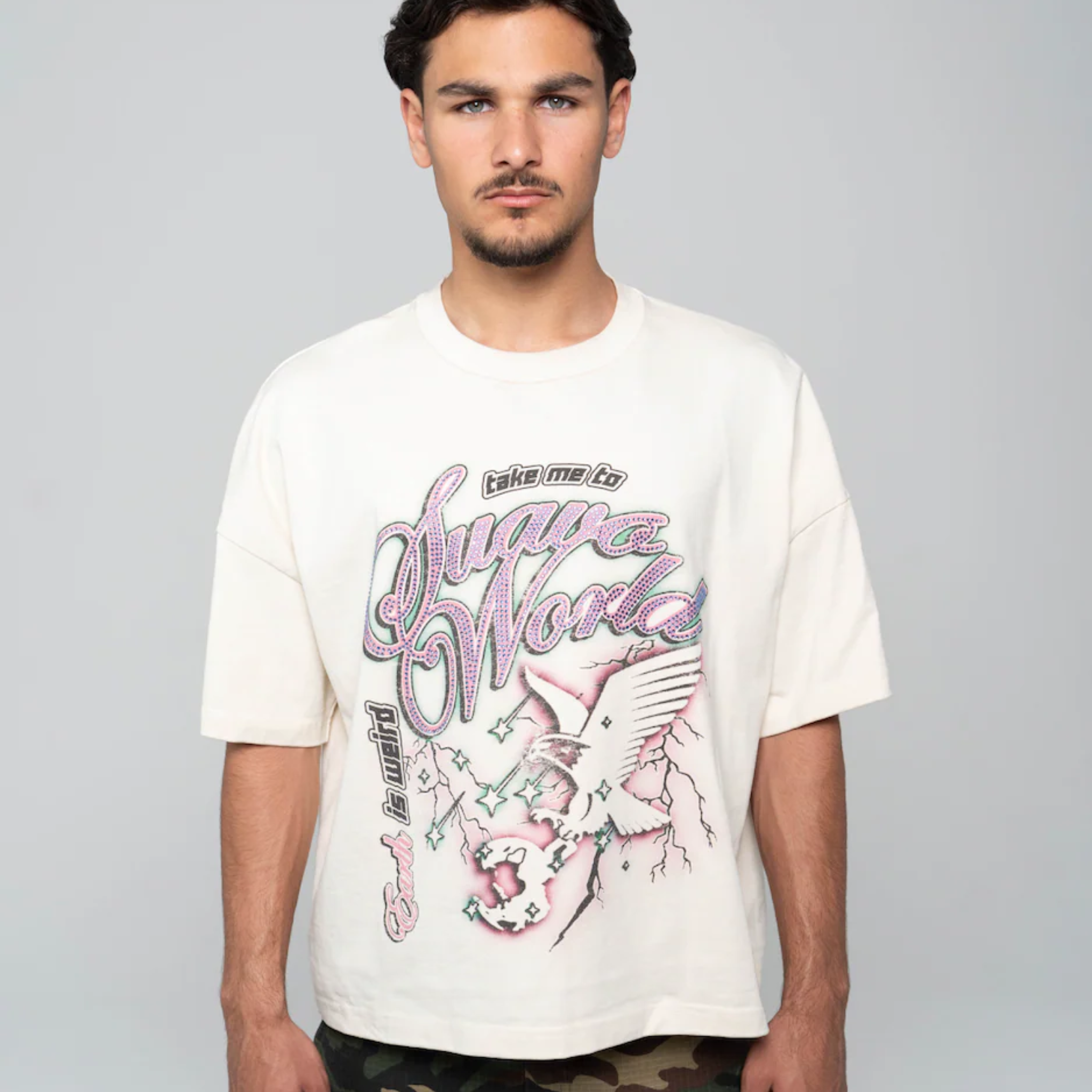 Man wearing white Suavo World Take Me 2 Heavyweight Tee with graphic print