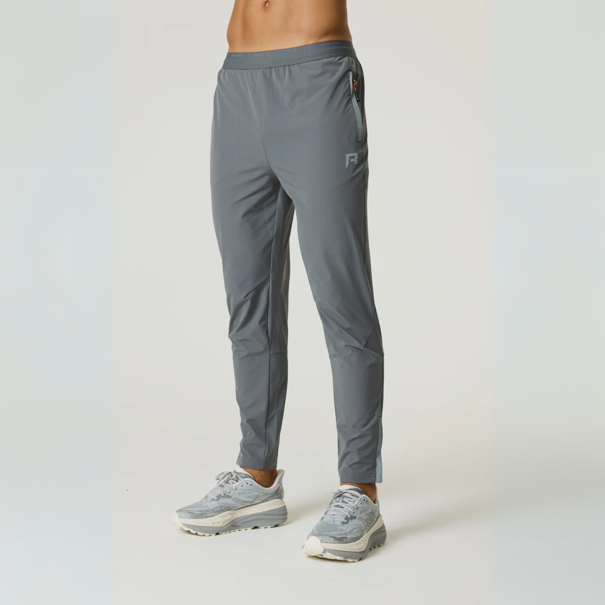 Reprimo Summit Pant in slate and light grey with lockable zip puller and jacquard waistband designed for athletic performance.