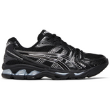 Black ASICS Gel Kayano 14 running shoe with pure silver accents and cushioned sole