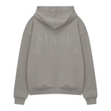 Siarr Puff Hoodie in dove grey with puff print logo on back, pullover style, kangaroo pocket, and ribbed cuffs.
