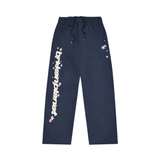 Broken Planet Market navy straight-leg sweatpants with pink star accents and logo print