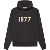 Fear of God Essentials 1977 hoodie in iron color with front pocket and printed 1977 logo