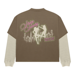 Strip Society T-Shirt with layered brown short sleeve, built-in textured long sleeves, pink graphic skyline and "Memories Are Made Faster" text