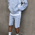 Siarr Orbit Shorts in Powder Blue with adjustable waist and zipped pockets.