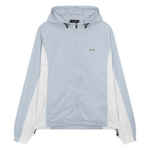 Siarr Orbit Windbreaker in powder blue with silicone logo patch, drawcord hood, and side slit pockets.