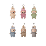 POP MART LABUBU The Monsters Exciting Macaron keychains in various pastel colors.