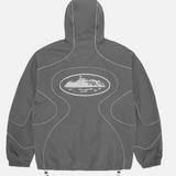 Corteiz x Nike NRG Jacket in Gully Grey with hood and abstract back design.