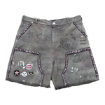 Suavo World Route 66 Shorts in washed sage with distressed raw-cut hems and hand-drawn graffiti artwork