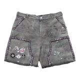 Suavo World Route 66 Shorts in washed sage with distressed raw-cut hems and hand-drawn graffiti artwork