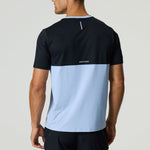 Back view of man wearing black and dusky sky Reprimo Flight T-Shirt with reflective strip and two-color block design