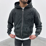 Siarr Ripped Hoodie with distress detailing and zip-up front.