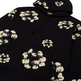 Denim Tears x CPFM black hoodie with floral wreath design.