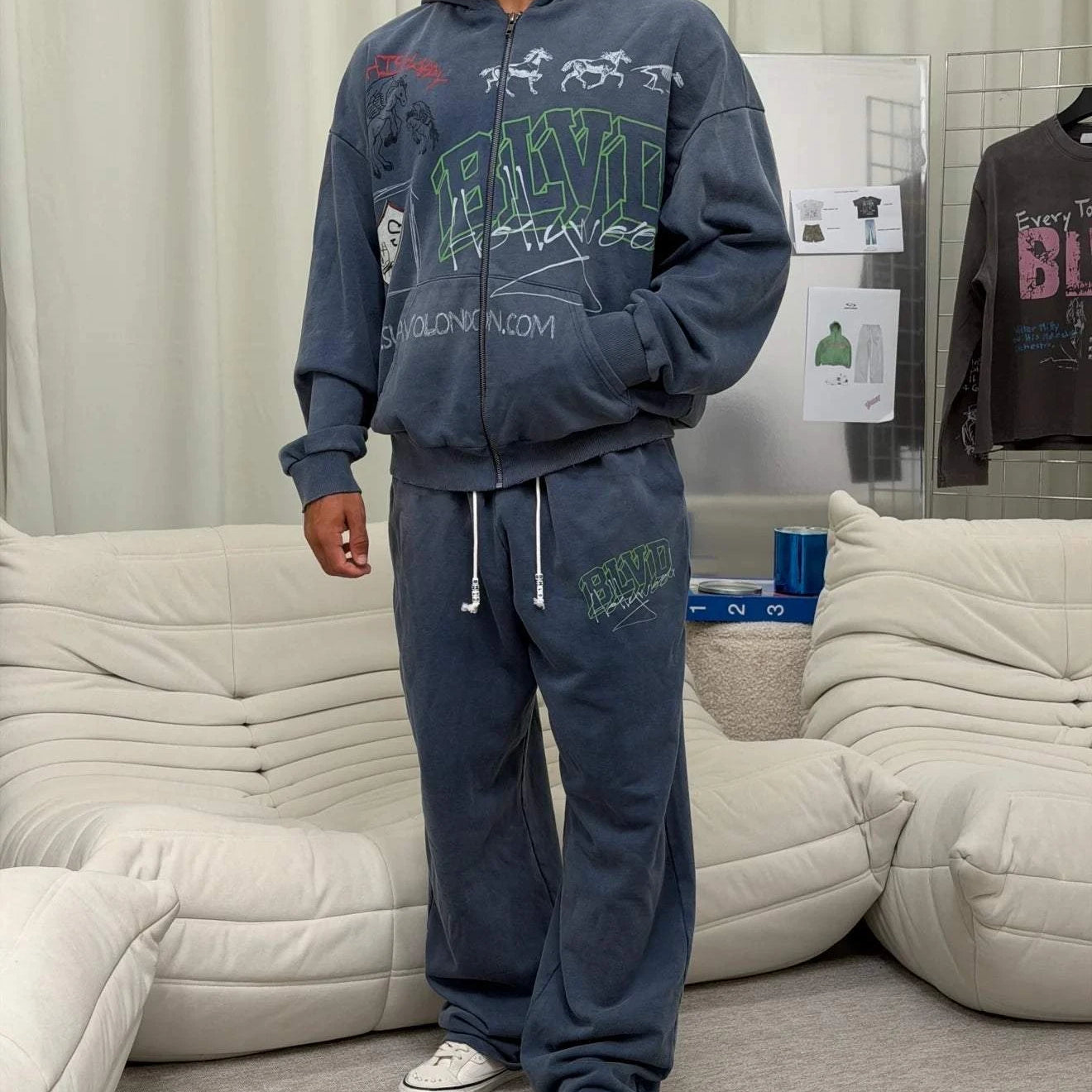 Suavo World Salt Lake City washed blue sweatpants with bold green 3D BLVD graphic and wide-leg fit