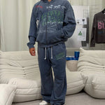 Suavo World Salt Lake City washed blue sweatpants with bold green 3D BLVD graphic and wide-leg fit