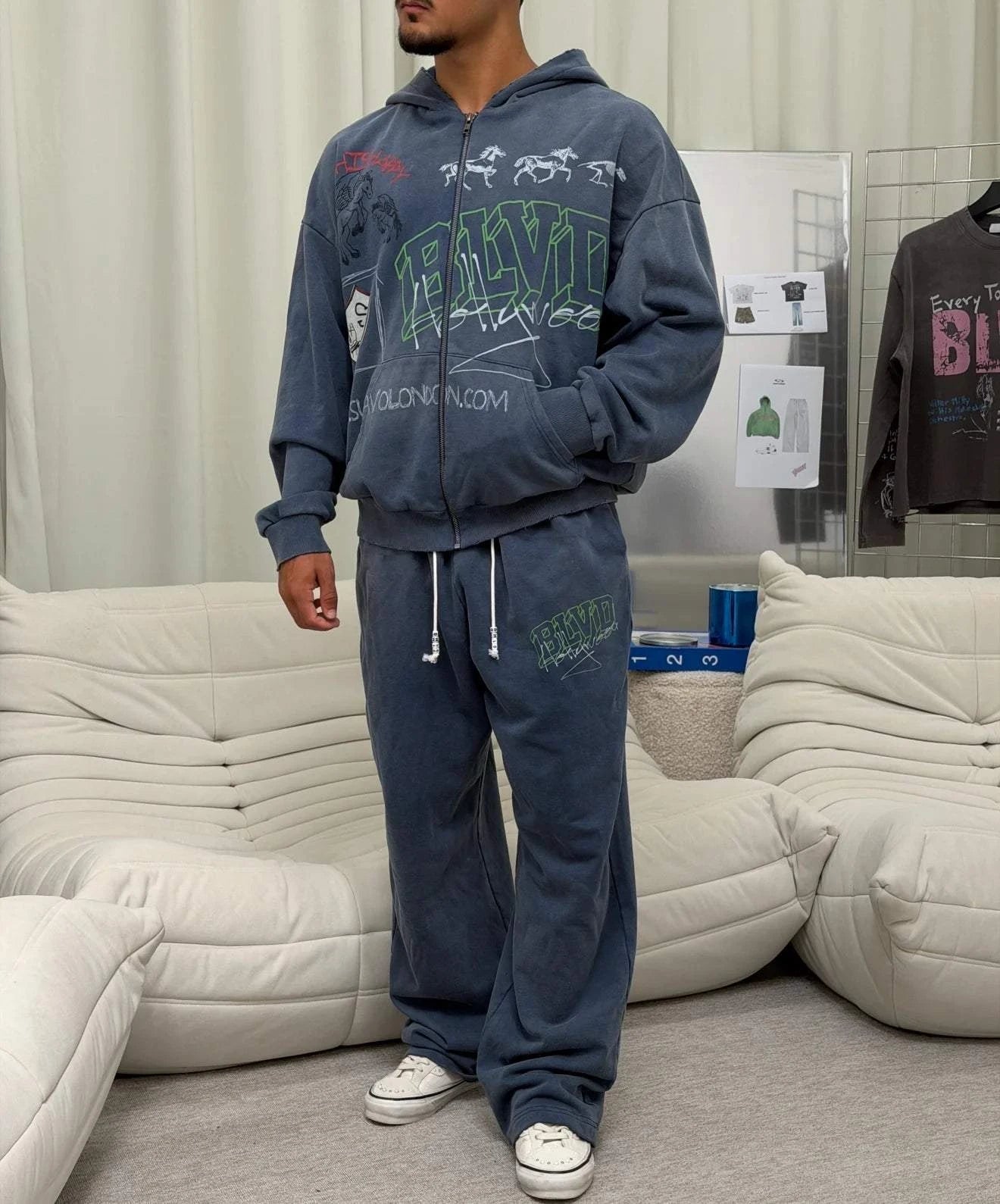 Suavo World Salt Lake City washed blue sweatpants with bold green 3D BLVD graphic and wide-leg fit