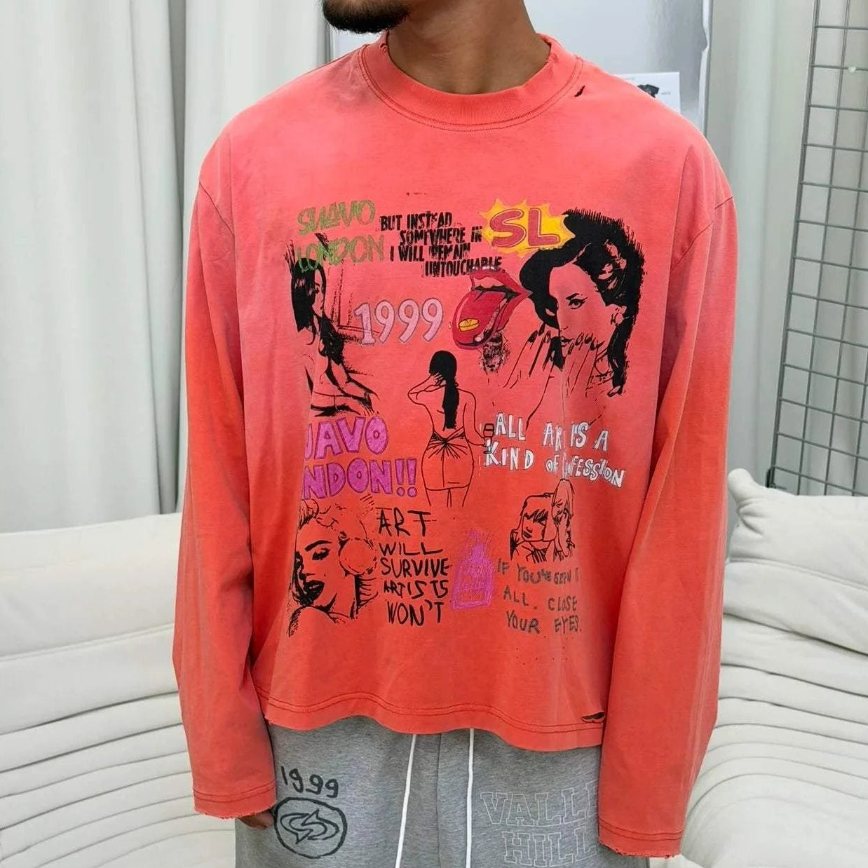 Suavo World Mirinda Long Sleeve in washed orange with vibrant punk-inspired graphics and vintage pop-art design