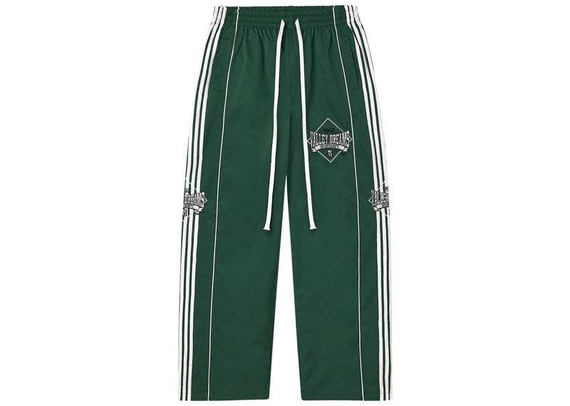 Vale Forever green stripe trackpants laid flat on white background