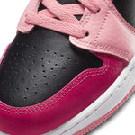 Air Jordan 1 Mid Coral Chalk GS close-up featuring black and pink upper with white midsole.