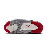 Air Jordan 4 Retro Bred Reimagined GS sneaker outsole with black, red, and grey accents.