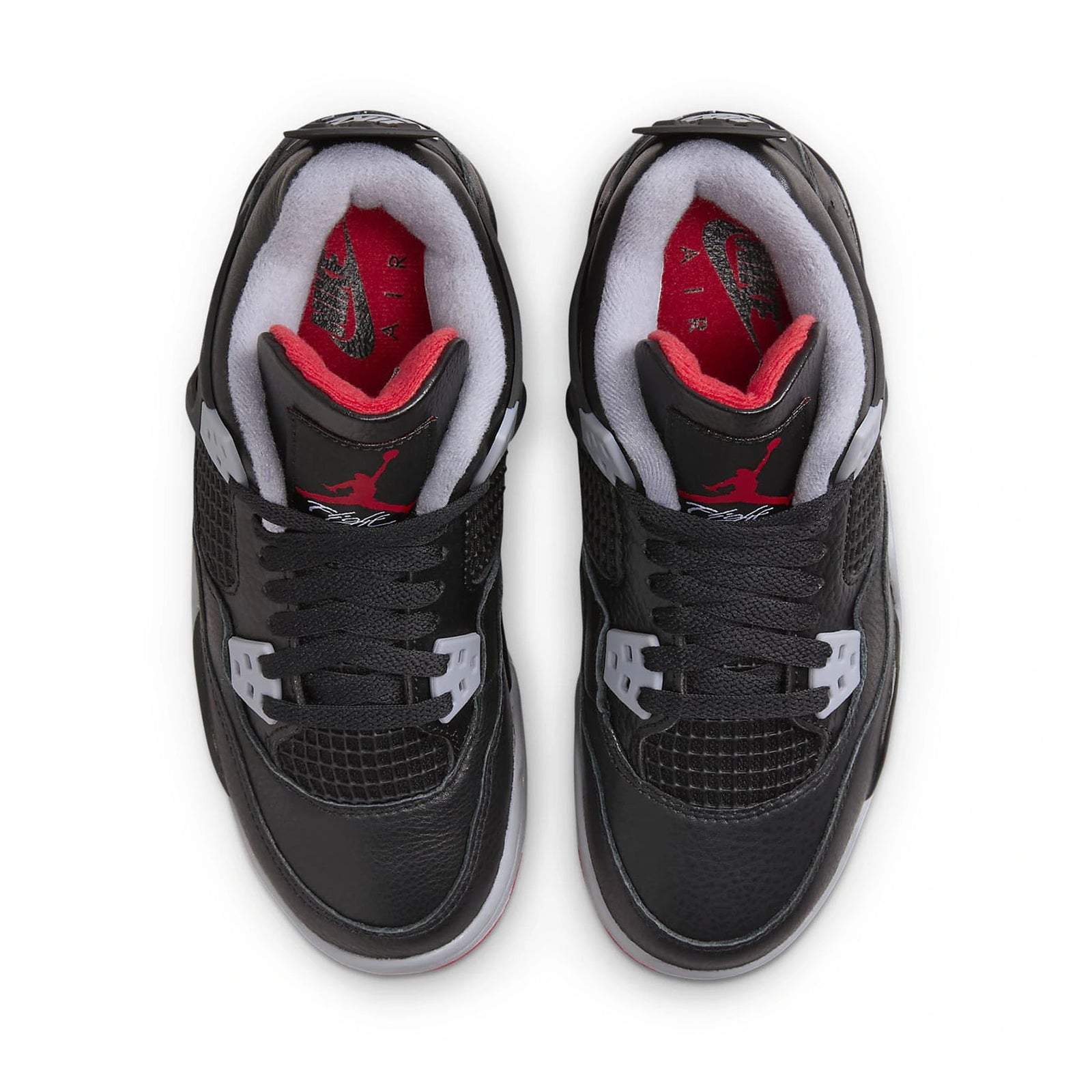 Air Jordan 4 Retro Bred Reimagined GS sneakers with black and red colorway, top view.