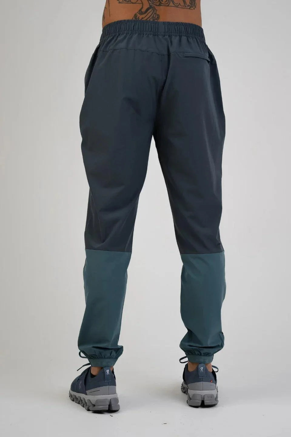 Reprimo Glide Pants in Azure and Shadow Blue, back view.
