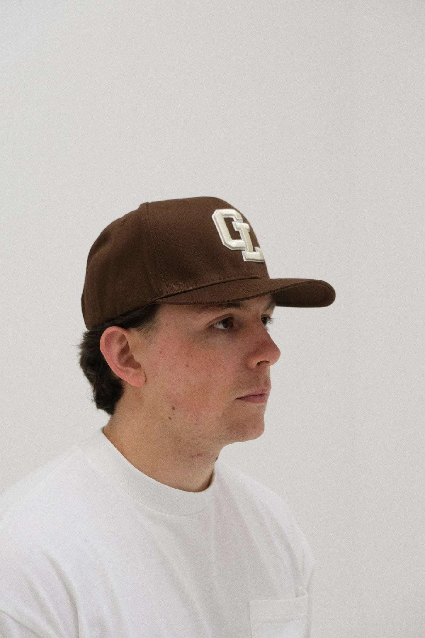 Cherry Location CL Brown Cap on textured background