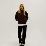 Cherry Location Brown Hoodie front view with hood up on plain background