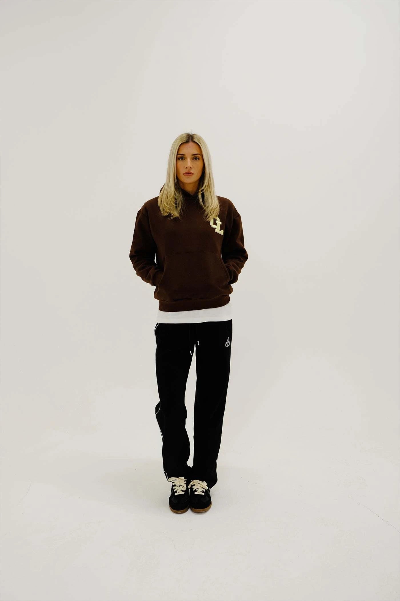 Cherry Location Brown Hoodie front view with hood up on plain background