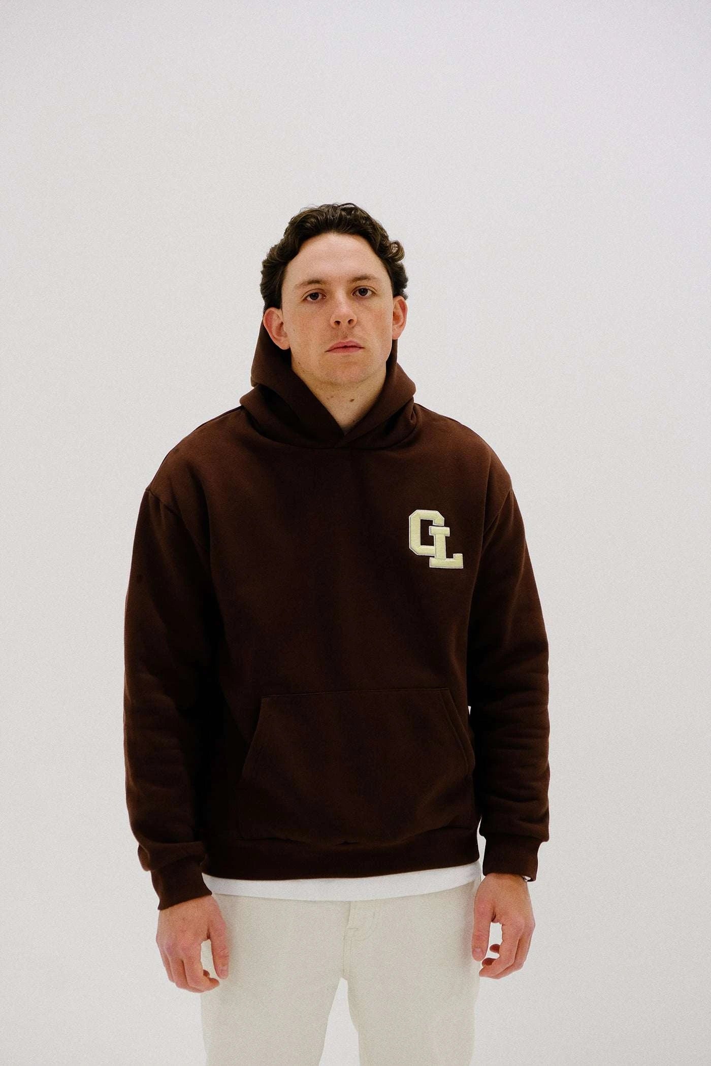 Cherry Location Brown Hoodie front view on white background