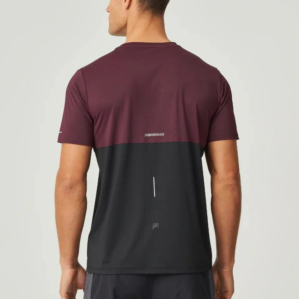 Back view of man wearing burgundy and obsidian Reprimo Impact T-Shirt with ergonomic fit and color pop accents