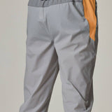 Reprimo Flight Pants in grey with orange accents.