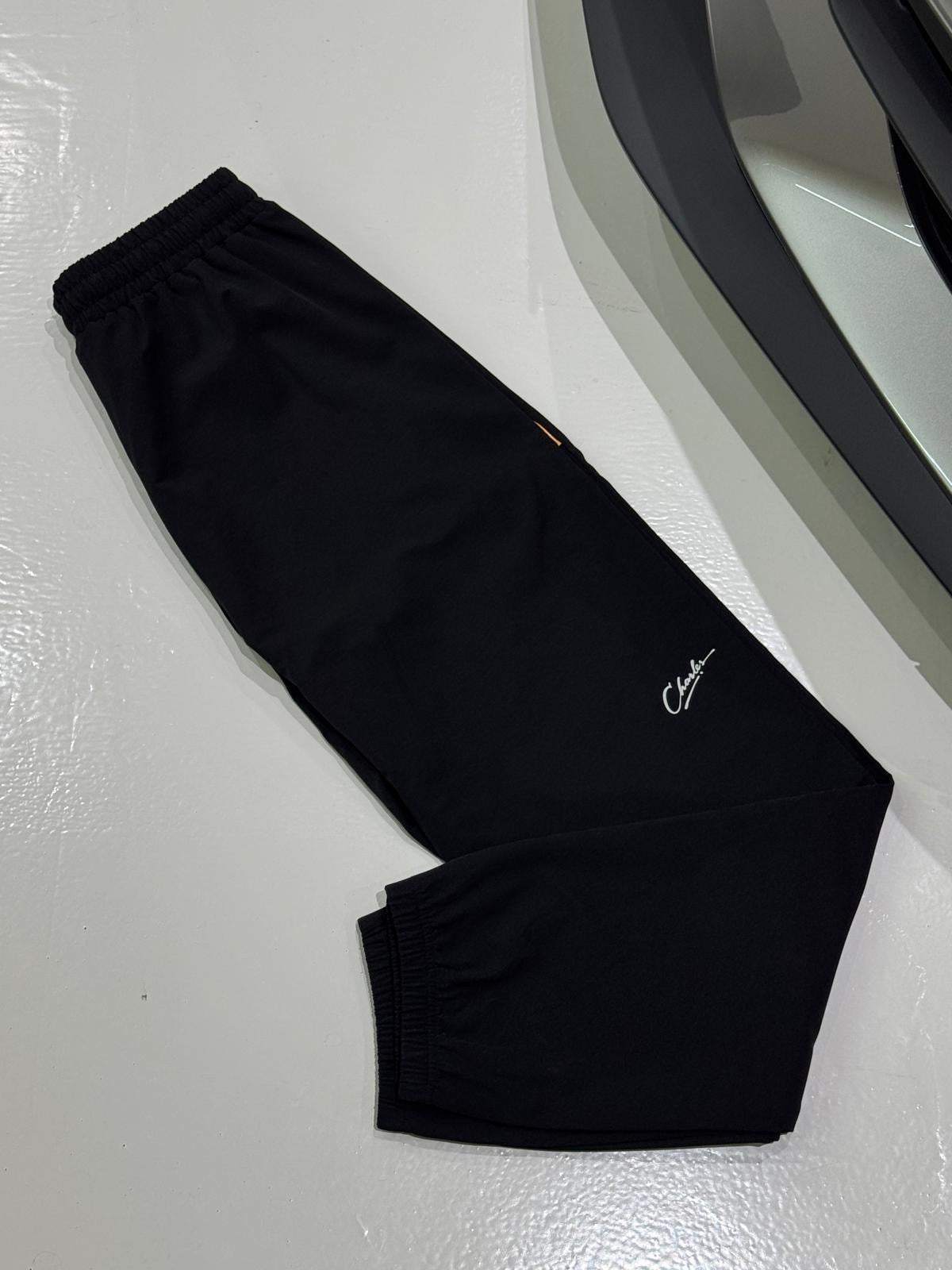 Studio By Charles black trackpants with elastic cuffs and logo embroidery